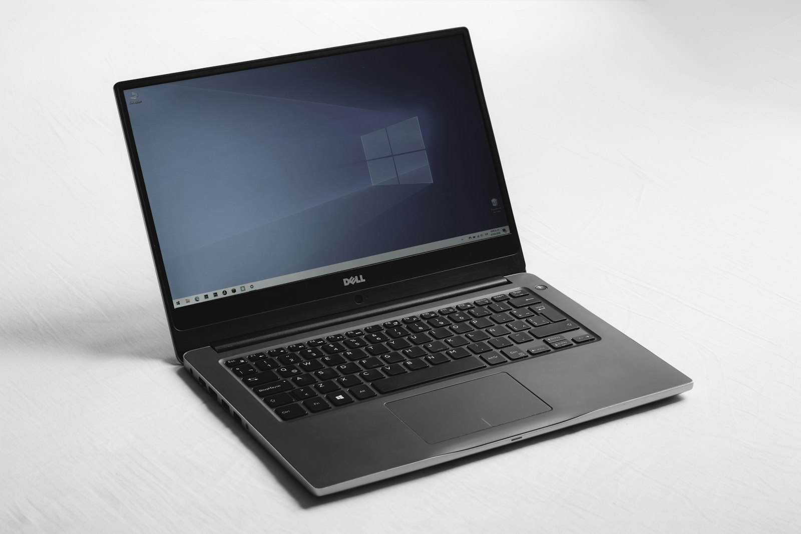 Open silver laptop on a desk